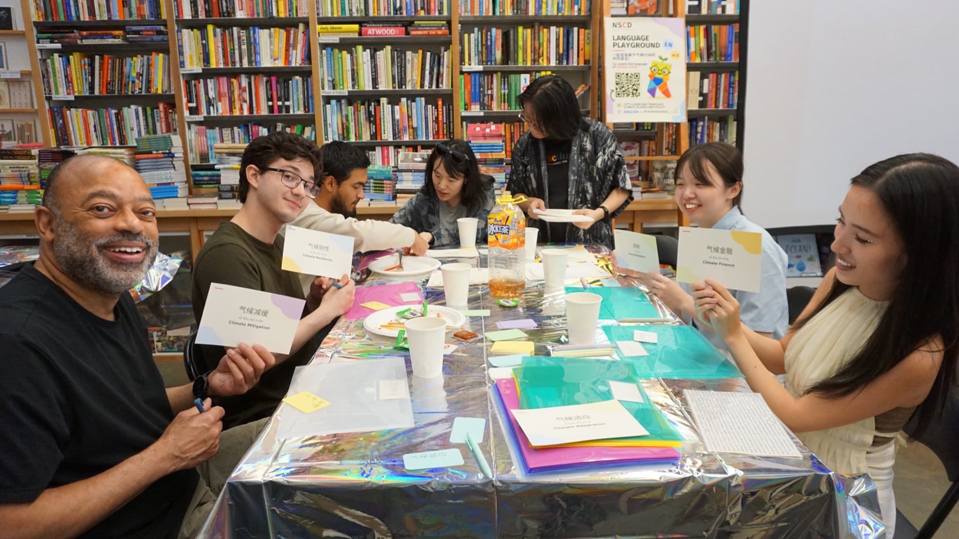 Participants gathered around the table for the Language Playground workshop at Upstart & Crow Studio.